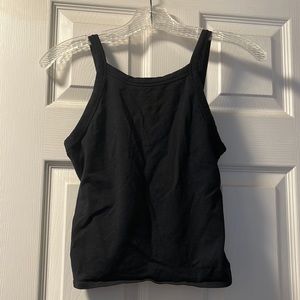 Garage black tank top. Lower cut in the back. Size medium.